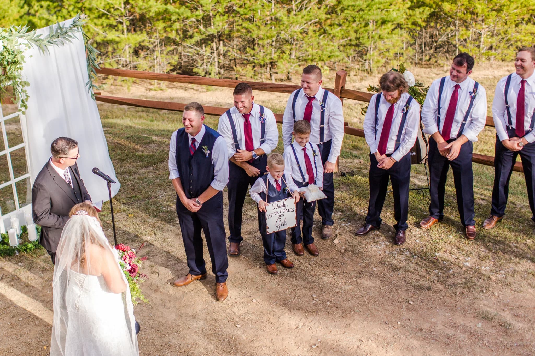 Outdoor wedding ceremony at a white draped arbor at Moose Hollow Lodge in Pigeon Forge near Smoky Mountains