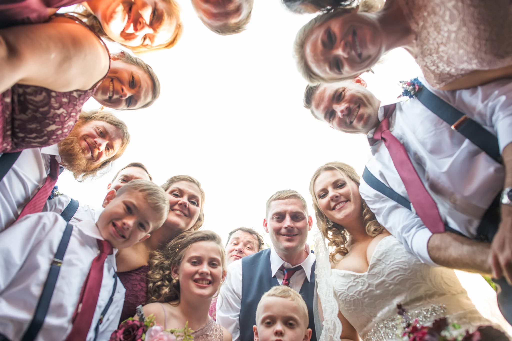 Smiling wedding party huddle at Moose Hollow Lodge in Pigeon Forge near Dollywood and the Smoky Mountains