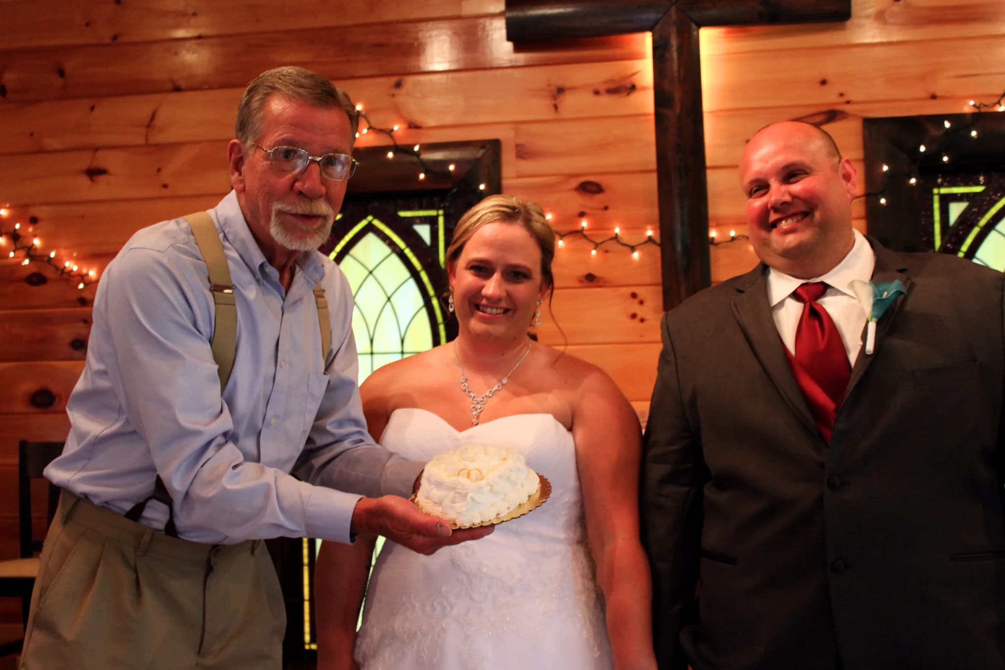 Rustic log wedding chapel with stained glass at Moose Hollow Lodge in Pigeon Forge