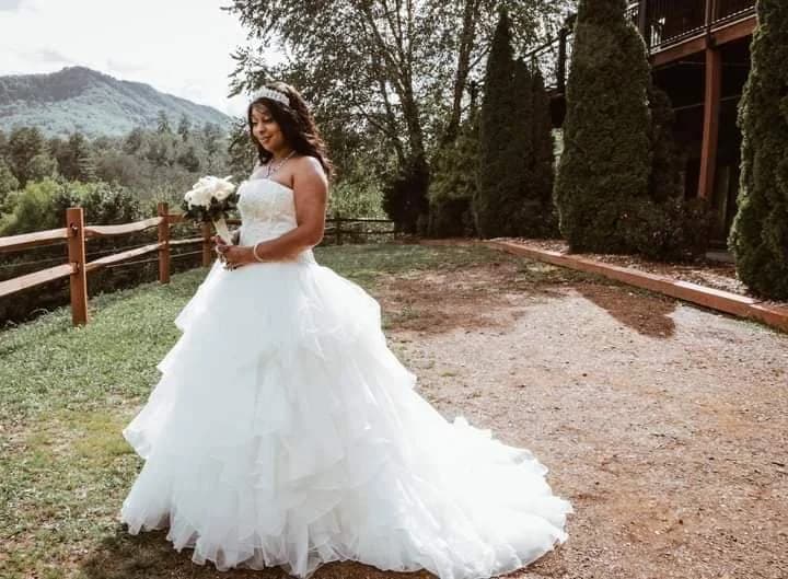 Bride in white gown with mountain views at Moose Hollow Lodge in Pigeon Forge near Dollywood and Smoky Mountains