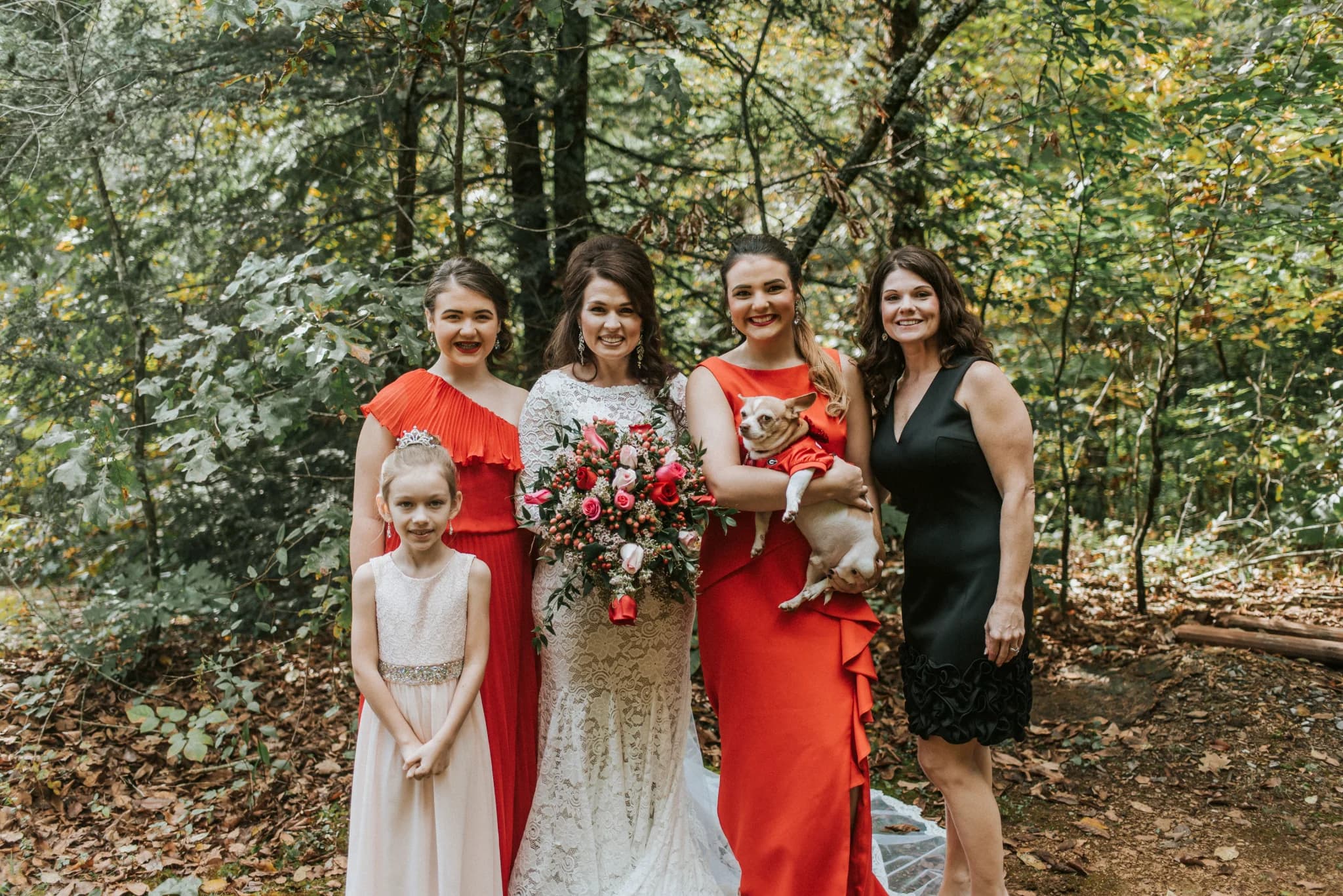Bride and bridal party in a forest at Moose Hollow Lodge in Pigeon Forge near Dollywood and the Smoky Mountains