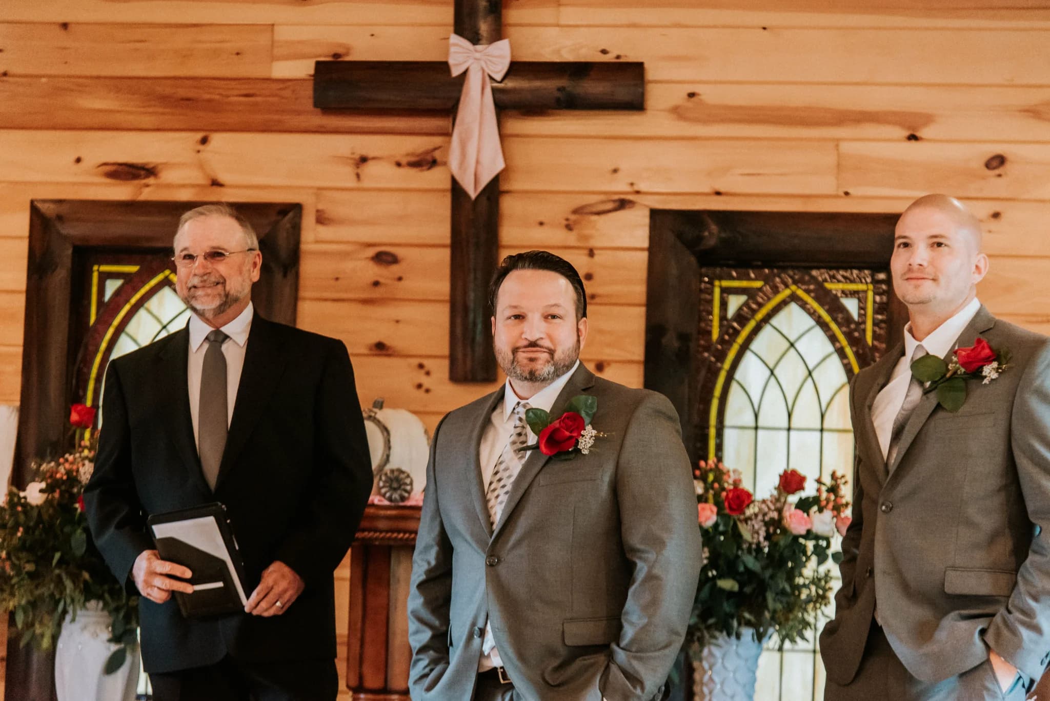 Rustic wedding chapel with wood walls and stained glass windows at Moose Hollow Lodge in Pigeon Forge