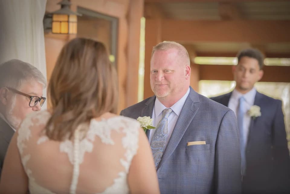 Intimate wedding ceremony on a rustic porch at Moose Hollow Lodge in Pigeon Forge near the Smoky Mountains.