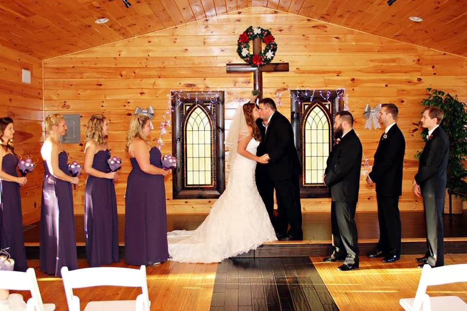 Wedding ceremony in a rustic wood-paneled chapel at Moose Hollow Lodge in Pigeon Forge