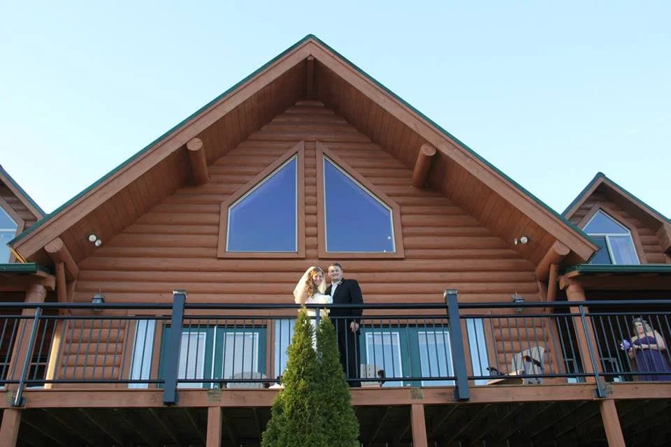 Newlyweds on a cabin balcony at Moose Hollow Lodge in Pigeon Forge near Dollywood and Smoky Mountains