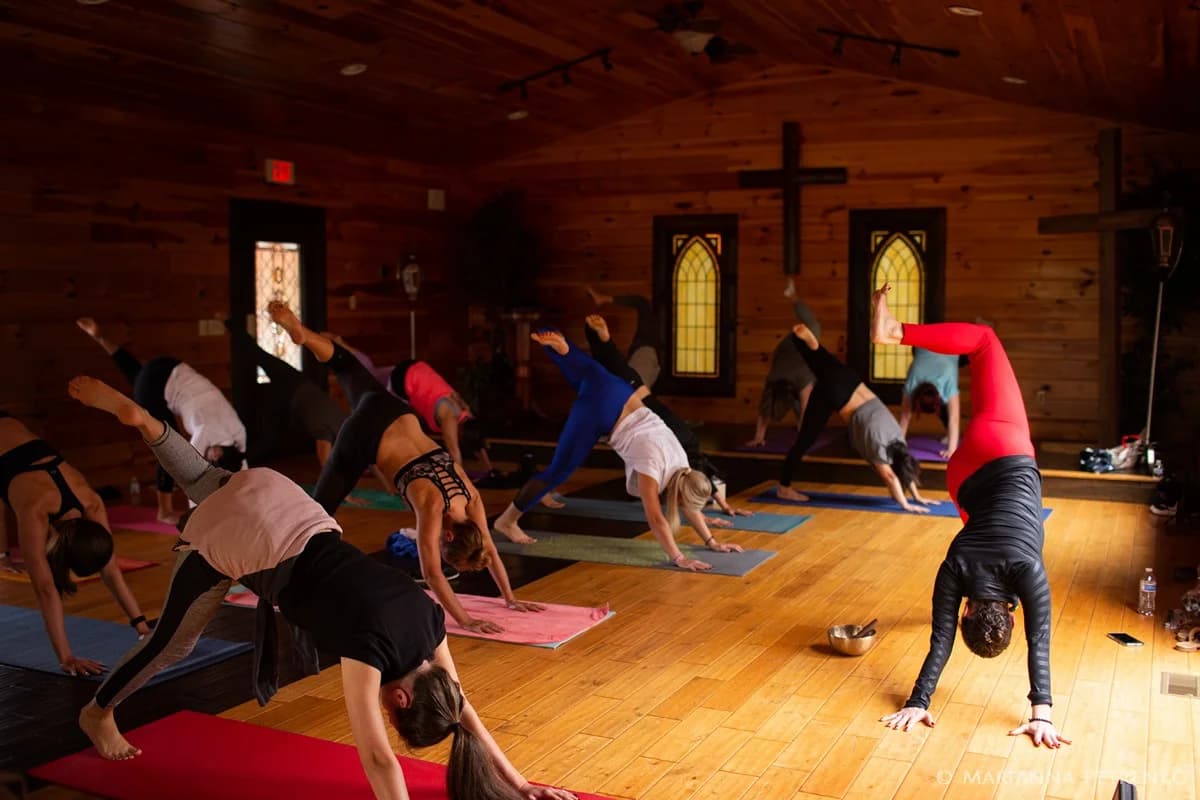 Yoga retreat in a rustic wooden chapel hall at Moose Hollow Lodge in Pigeon Forge
