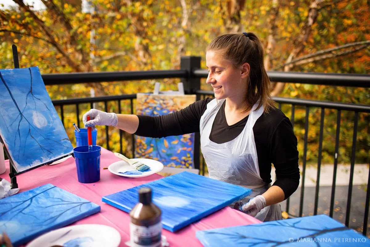 Outdoor painting on a deck with autumn forest views at Moose Hollow Lodge near Dollywood in Pigeon Forge