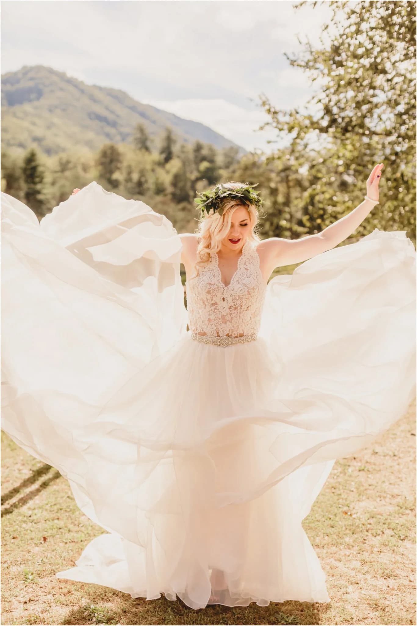 Bride in flowing lace gown with Smoky Mountain views at Moose Hollow Lodge in Pigeon Forge near Dollywood