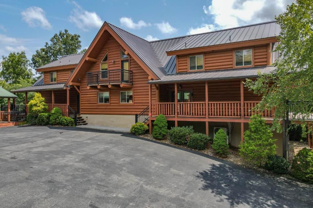Large luxury log cabin exterior with covered porches near Dollywood at Moose Hollow Lodge in Sevierville