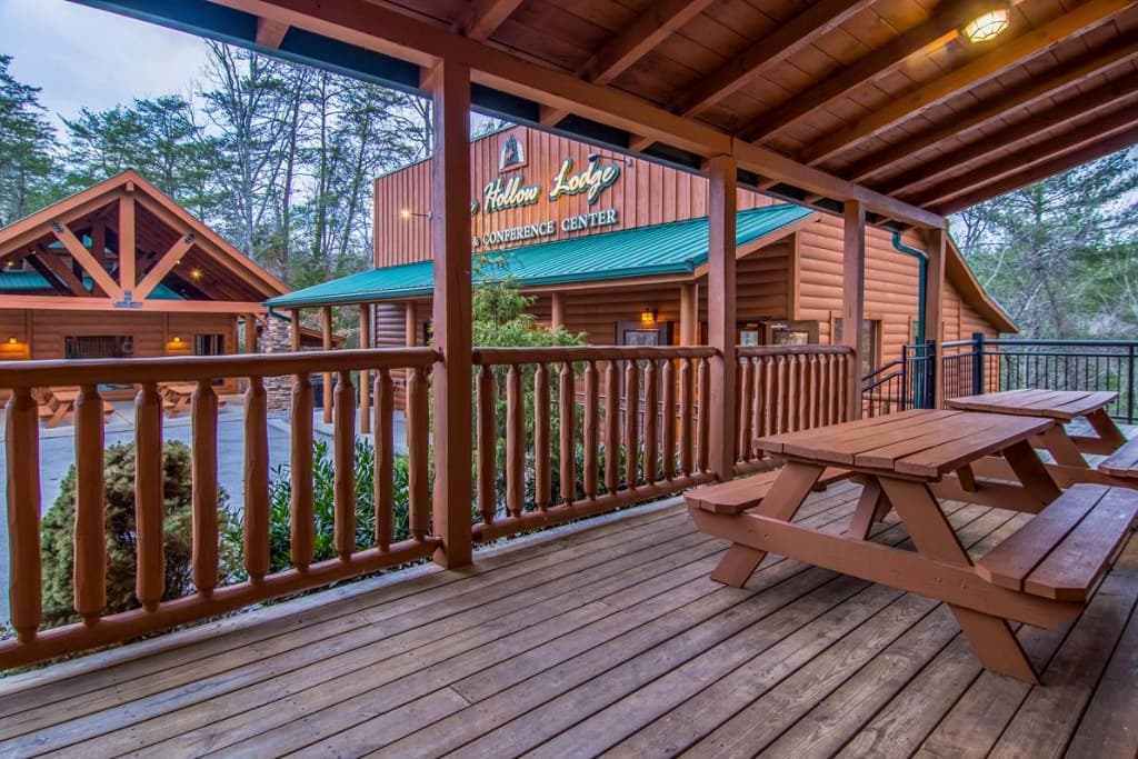 Covered deck with picnic tables and lodge views at Moose Hollow Lodge near Dollywood and the Smoky Mountains