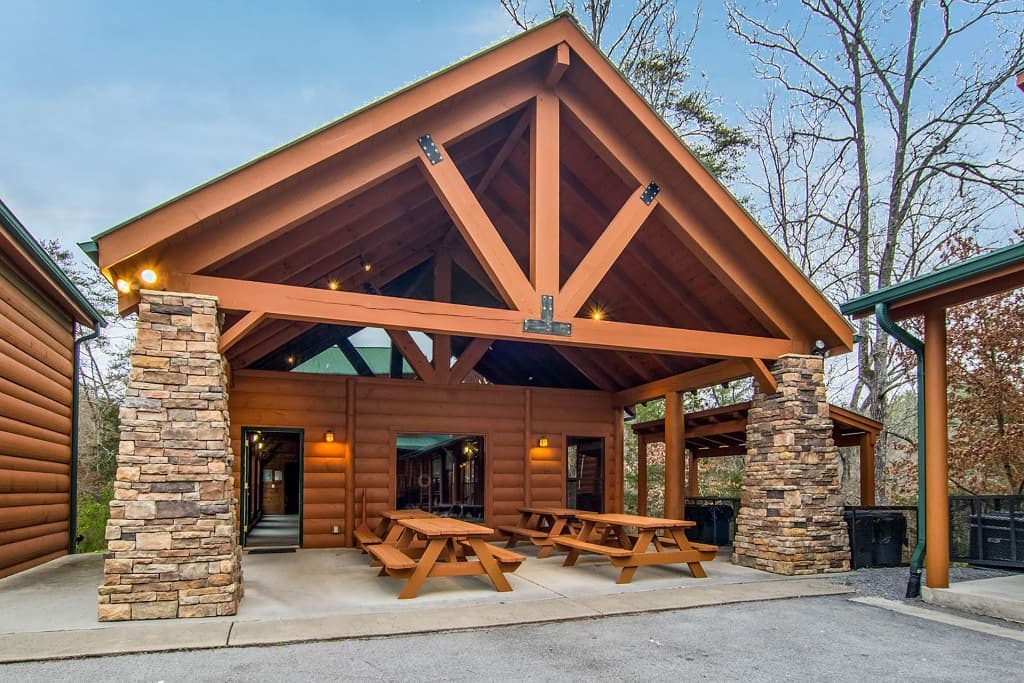 Covered pavilion with picnic tables and stone pillars at Moose Hollow Lodge near Dollywood in the Smoky Mountains.